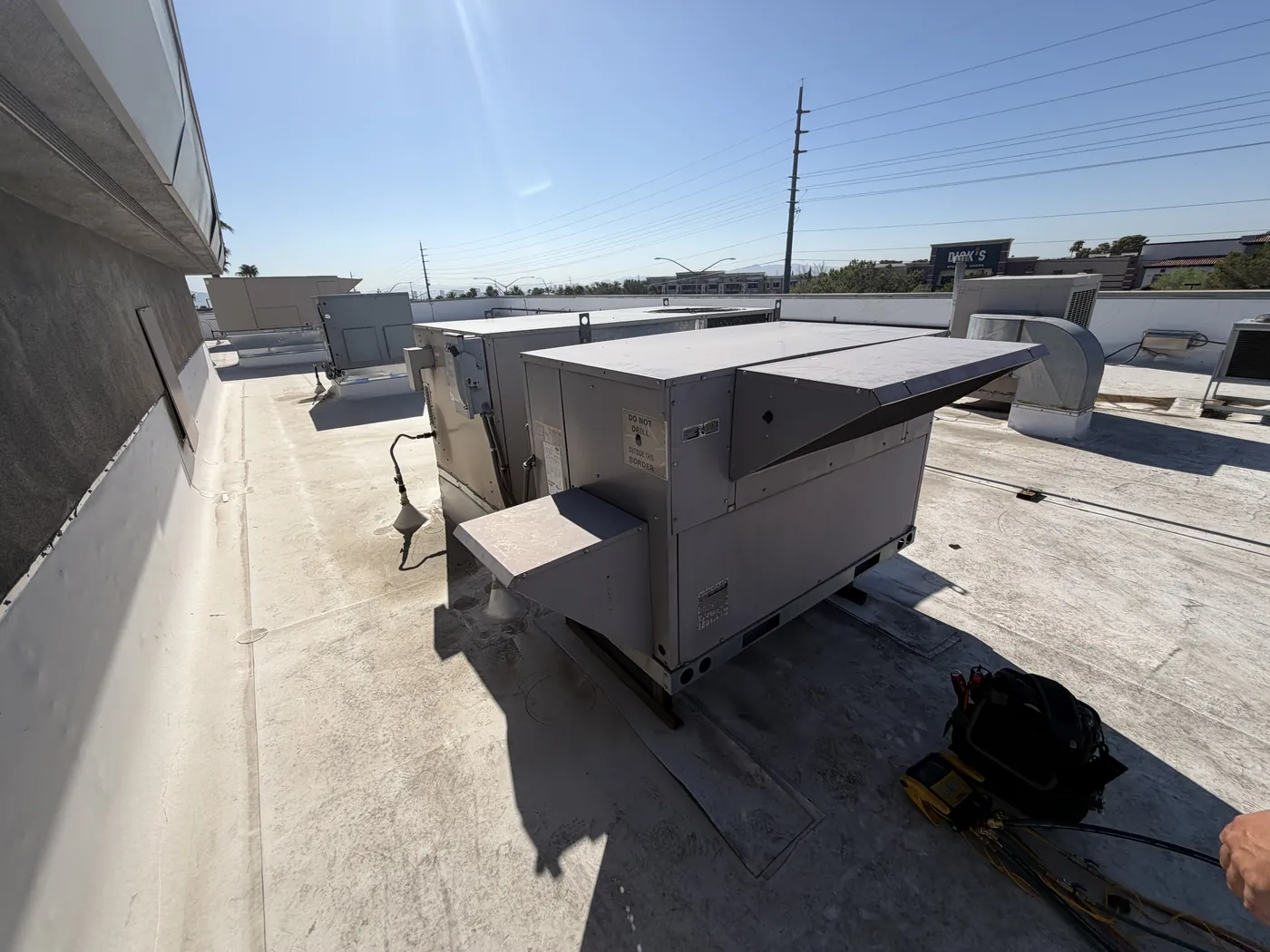 Commercial style rooftop package unit on a flat roof